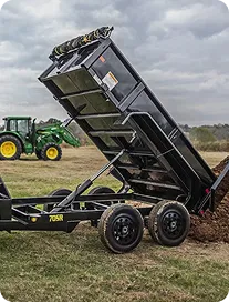 Black truck dispoing dirt load